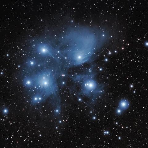 photo of the Pleiades star cluster and nebula