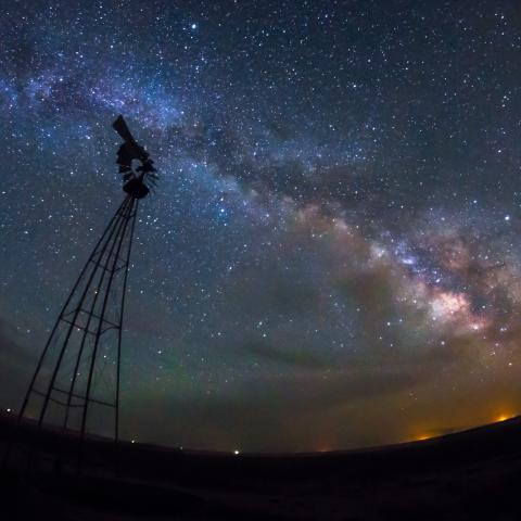 photo of the milky way and a windmill