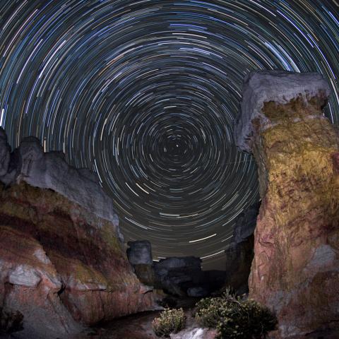 photo of star trails and rock formations
