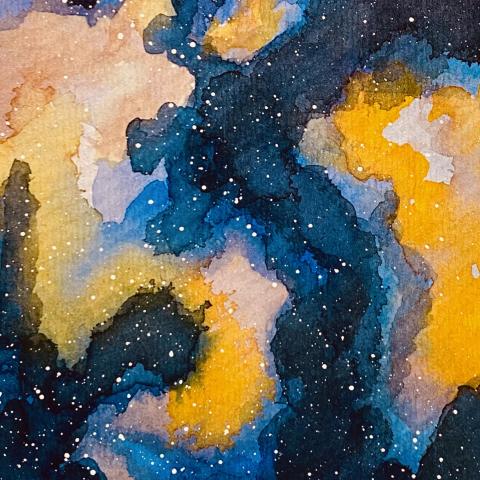 A photograph of an abstract watercolor painting of nebulae