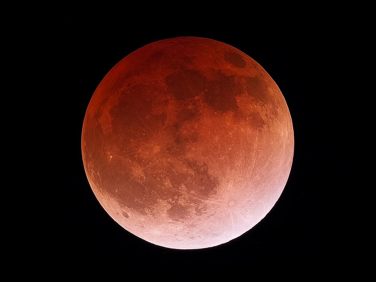 photo of a red moon during a total lunar eclipse