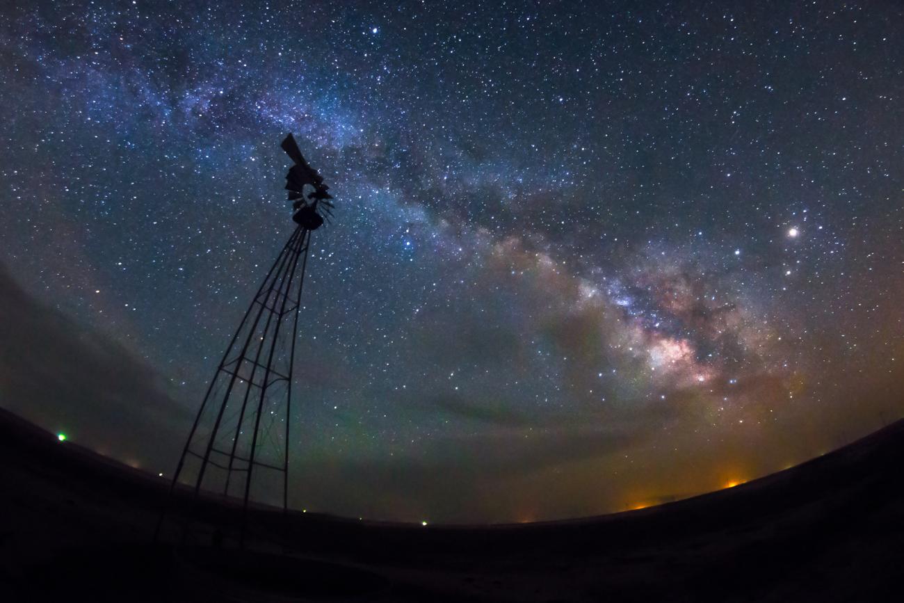 photo of the milky way and a windmill